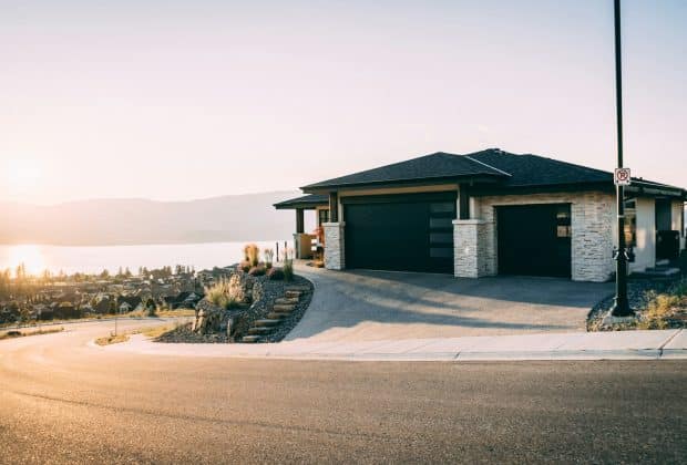 house 2 garage doors are both close during daytime